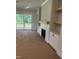 Living room area features a modern fireplace, built-in cabinets, and access to an outdoor balcony at 9000 Penny Rd, Raleigh, NC 27606