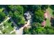Aerial view of the house with lots of surrounding nature and greenery at 9700 Pentland Ct, Raleigh, NC 27614