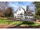 Spacious backyard featuring a trampoline and a view of the white home at 9700 Pentland Ct, Raleigh, NC 27614