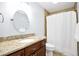 Traditional bathroom featuring granite countertops and a shower with a curtain at 9700 Pentland Ct, Raleigh, NC 27614