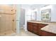 Bathroom featuring a glass enclosed shower, double sink vanity, and granite countertops at 9700 Pentland Ct, Raleigh, NC 27614