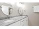 Bright bathroom featuring double vanity with granite countertop and modern fixtures at 9700 Pentland Ct, Raleigh, NC 27614