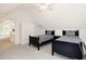 Bedroom featuring two twin beds, white vaulted ceilings, and closet space at 9700 Pentland Ct, Raleigh, NC 27614