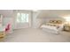 Bright bedroom with sloped ceilings, a large window, and charming decor at 9700 Pentland Ct, Raleigh, NC 27614