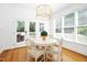 Charming breakfast nook boasts a modern chandelier and access to a patio at 9700 Pentland Ct, Raleigh, NC 27614