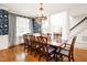 Spacious dining room with hardwood floors, chandelier, and designer wallpaper at 9700 Pentland Ct, Raleigh, NC 27614
