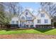 Charming white home with blue shutters, well-manicured lawn, and inviting curb appeal at 9700 Pentland Ct, Raleigh, NC 27614