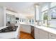 A well-lit kitchen features stainless appliances, marble counters and eat-in breakfast area at 9700 Pentland Ct, Raleigh, NC 27614