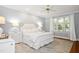 Serene main bedroom featuring soft color palette and a large window with natural light at 9700 Pentland Ct, Raleigh, NC 27614