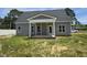 Gray home featuring a covered back porch with white columns and trim at 1039 N Lincoln St, Benson, NC 27504