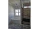 An in-progress bathroom features a white tub and separate shower, awaiting final touches and fixtures at 1039 N Lincoln St, Benson, NC 27504