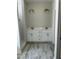 Bathroom featuring double sink vanity, marble floors and a walk-in shower at 1039 N Lincoln St, Benson, NC 27504