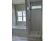 Bathroom showcasing a tub, shower, and window for natural light at 1039 N Lincoln St, Benson, NC 27504
