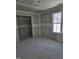Bedroom with walk-in closet and bright window at 1039 N Lincoln St, Benson, NC 27504