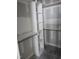 Walk-in closet with white shelving and natural wood closet rods at 1039 N Lincoln St, Benson, NC 27504