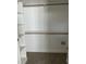 A walk-in closet with wood clothing rods and shelving for optimal storage solutions at 1039 N Lincoln St, Benson, NC 27504