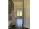 Dining room with hardwood floors, white wainscoting, and stylish chandelier at 1039 N Lincoln St, Benson, NC 27504