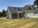 Beautiful craftsman-style home with gray siding, a well-maintained lawn, and an attached garage at 1039 N Lincoln St, Benson, NC 27504