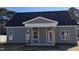 Charming gray home with a covered front porch and classic architectural details at 1039 N Lincoln St, Benson, NC 27504