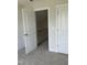 Hallway featuring carpeted floors and paneled doors, enhancing the home's interior design at 1039 N Lincoln St, Benson, NC 27504
