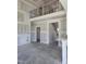 View of a large living room with a cathedral ceiling and access to the staircase and second level at 1039 N Lincoln St, Benson, NC 27504