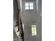 Bright foyer with staircase featuring wood treads, black metal railings, and a clerestory window at 1039 N Lincoln St, Benson, NC 27504