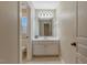 Well-lit bathroom featuring a vanity with storage, modern fixtures, and tiled floor at 105 Byron Ct, Oxford, NC 27565
