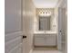 Well-lit bathroom featuring a vanity with storage, mirror, and tiled floor at 105 Byron Ct, Oxford, NC 27565
