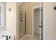 Clean and bright bathroom featuring tile floor, glass shower and storage closet at 105 Byron Ct, Oxford, NC 27565