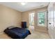 Bedroom featuring neutral carpet, natural light, and door to the bathroom at 105 Byron Ct, Oxford, NC 27565
