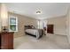 Spacious bedroom features carpet, neutral colors, and large windows offering plenty of natural light at 105 Byron Ct, Oxford, NC 27565