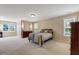 Spacious bedroom features carpet, neutral colors, and large windows offering plenty of natural light at 105 Byron Ct, Oxford, NC 27565