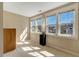 Sun-filled bedroom features carpet flooring, large windows, and neutral paint at 105 Byron Ct, Oxford, NC 27565