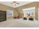 Open bonus room with carpet, dual windows, reading nook, and plenty of space at 105 Byron Ct, Oxford, NC 27565