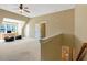Upstairs bonus room with carpet, ceiling fan, natural light, and staircase at 105 Byron Ct, Oxford, NC 27565
