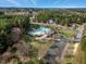 Aerial view of community pool with clubhouse, waterslide, and playground at 105 Byron Ct, Oxford, NC 27565