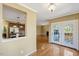 A dining area with glass doors leading to the outside deck and entrance to kitchen at 105 Byron Ct, Oxford, NC 27565