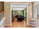 Elegant dining room with green walls, dark wood furniture, and a decorative chandelier at 105 Byron Ct, Oxford, NC 27565