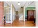 Spacious foyer featuring hardwood floors, staircase, and a view of the home's interior at 105 Byron Ct, Oxford, NC 27565