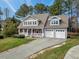 Inviting two-story home with a classic front porch and an attached two-car garage at 105 Byron Ct, Oxford, NC 27565
