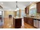 Open kitchen featuring granite counters, stainless steel appliances, and a central island at 105 Byron Ct, Oxford, NC 27565
