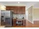 Kitchen with refrigerator and a built in desk area with overhead cabinets at 105 Byron Ct, Oxford, NC 27565