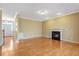 Large, bright living room with fireplace, hardwood floors, and recessed lighting at 105 Byron Ct, Oxford, NC 27565
