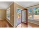 An open door leading to the deck with outdoor views at 105 Byron Ct, Oxford, NC 27565