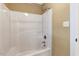 Standing shower with white shower surround, shower head, and additional hardware at 105 Byron Ct, Oxford, NC 27565