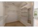 Spacious walk-in closet with shelving, rod, and natural light at 105 Byron Ct, Oxford, NC 27565