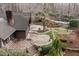 A sprawling backyard features a deck, lush landscaping, stone stairs, and a sparkling in-ground pool at 10729 Trego Trl, Raleigh, NC 27614