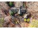 Aerial view of home featuring lush landscaping and a circular driveway at 10729 Trego Trl, Raleigh, NC 27614