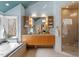Airy bathroom with a double vanity, soaking tub, and a separate glass-enclosed shower at 10729 Trego Trl, Raleigh, NC 27614