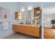 Modern bathroom featuring a floating vanity, decorative lighting, and contemporary fixtures at 10729 Trego Trl, Raleigh, NC 27614